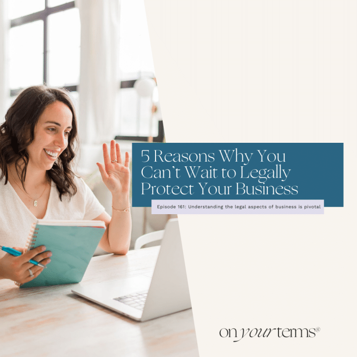 woman sitting at desk, smiling and holding a notebook with text overlay "5 Reasons Why You Can’t Wait to Legally Protect Your Business"