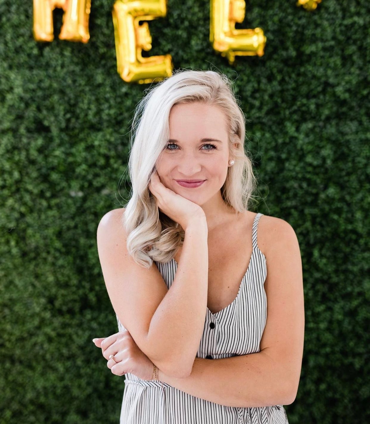 woman with shoulder length blonde hair and smiling