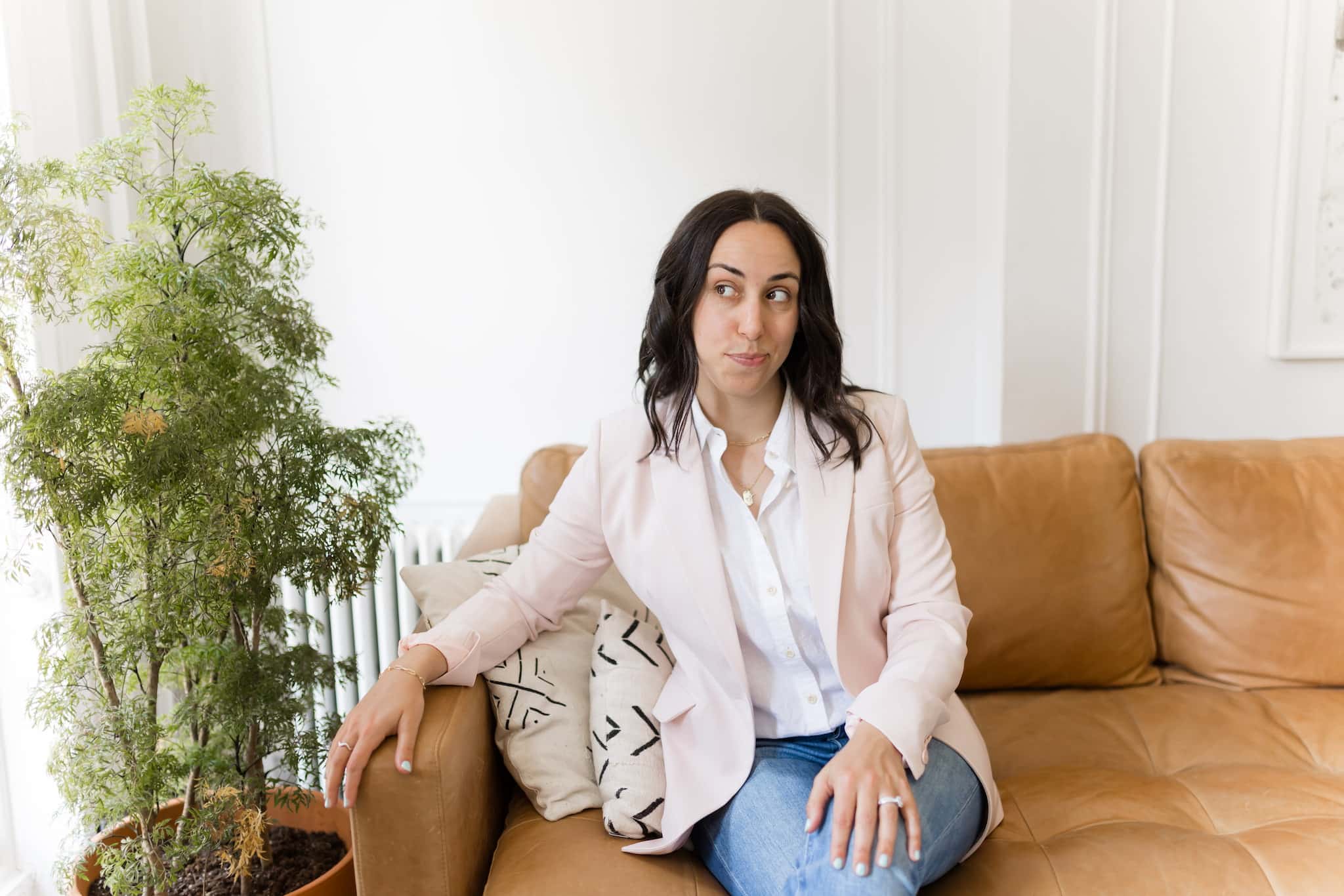 woman sitting while making a smirk expression