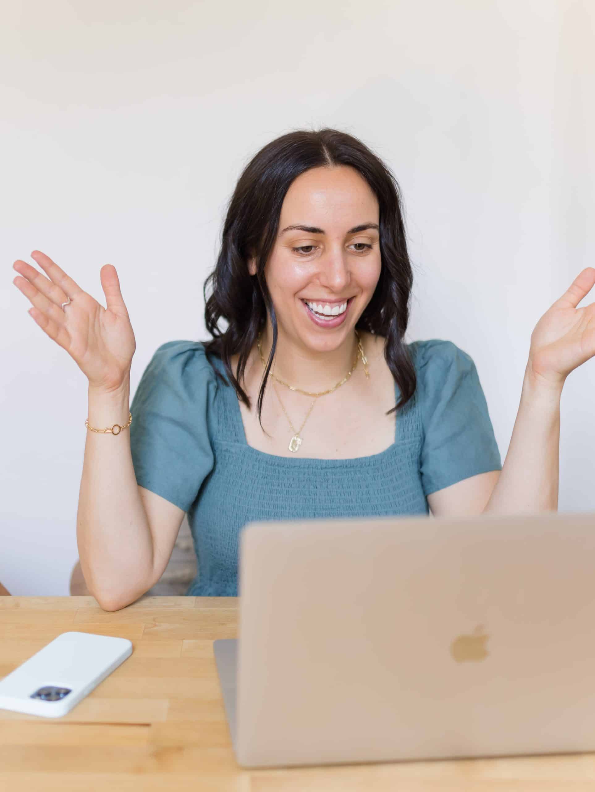 woman sitting in front of a laptop